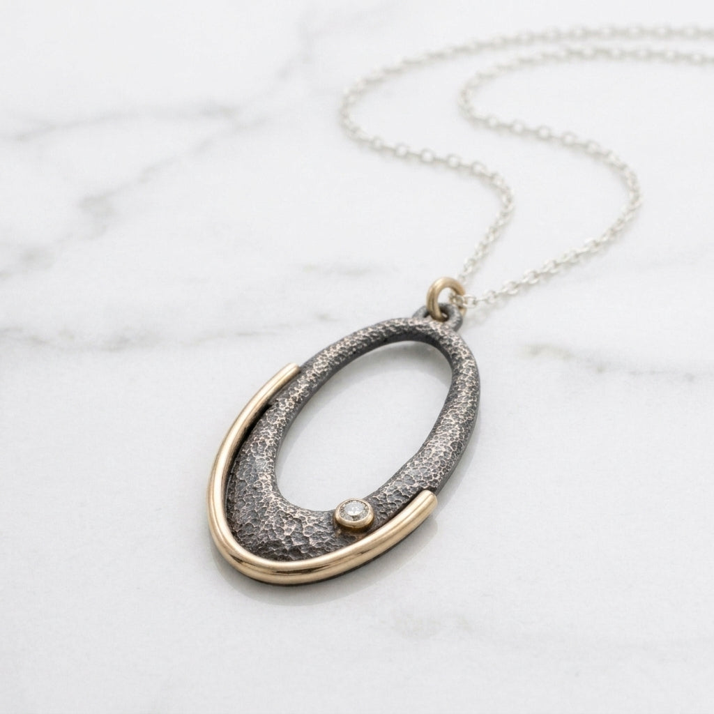 Gilded Arc Oval Pendant Necklace