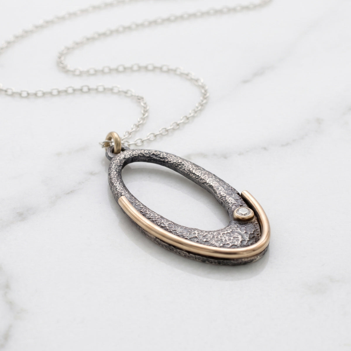 Gilded Arc Oval Pendant Necklace